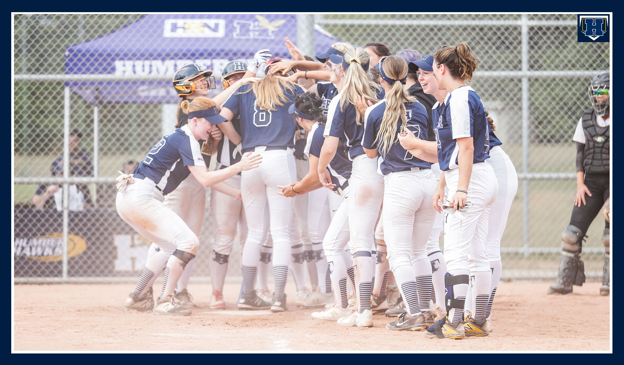 Softball team swarms McPherson after a homerun