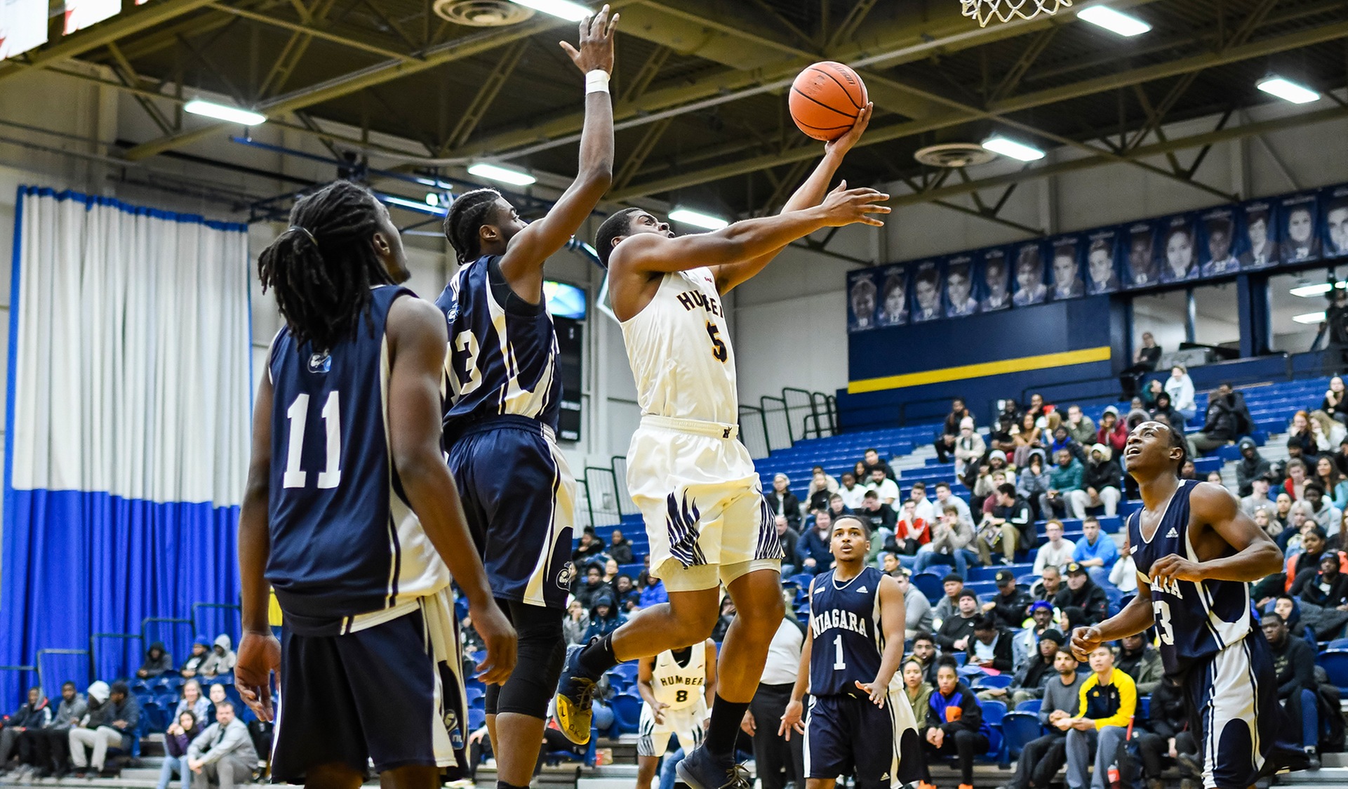 MARTIN FORCES OVERTIME TO HELP No. 2 MEN'S BASKETBALL RALLY OVER NIAGARA, 102-95