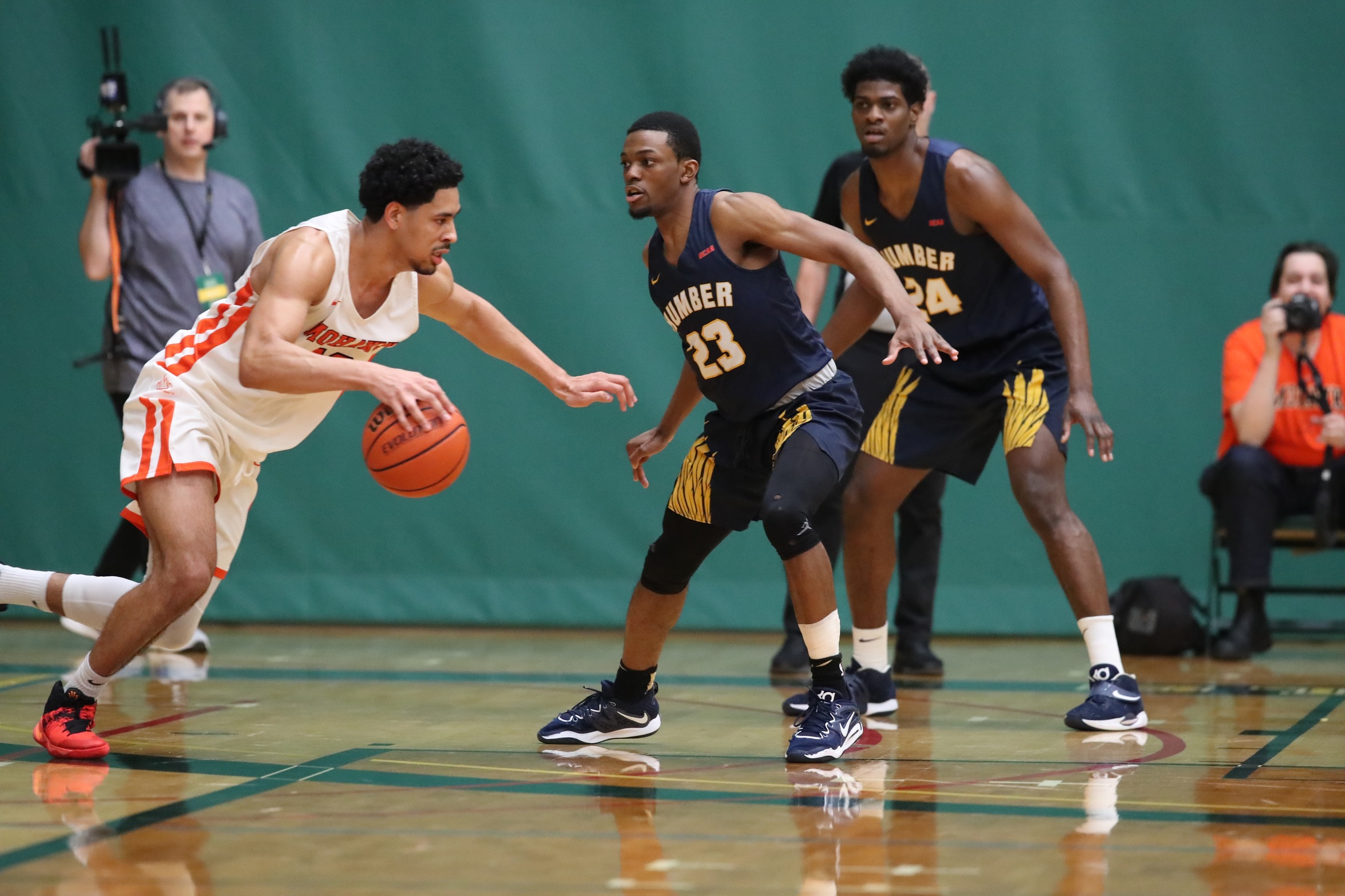 Lambert-Cadore and Chambers playing defence