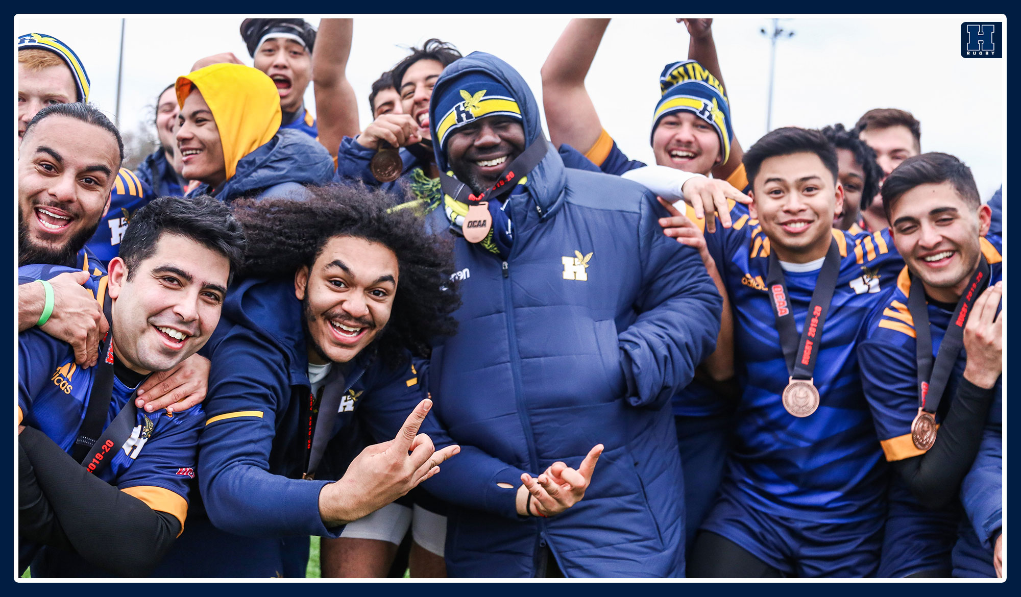 Men's rugby celebrates its bronze medal win in 2019.