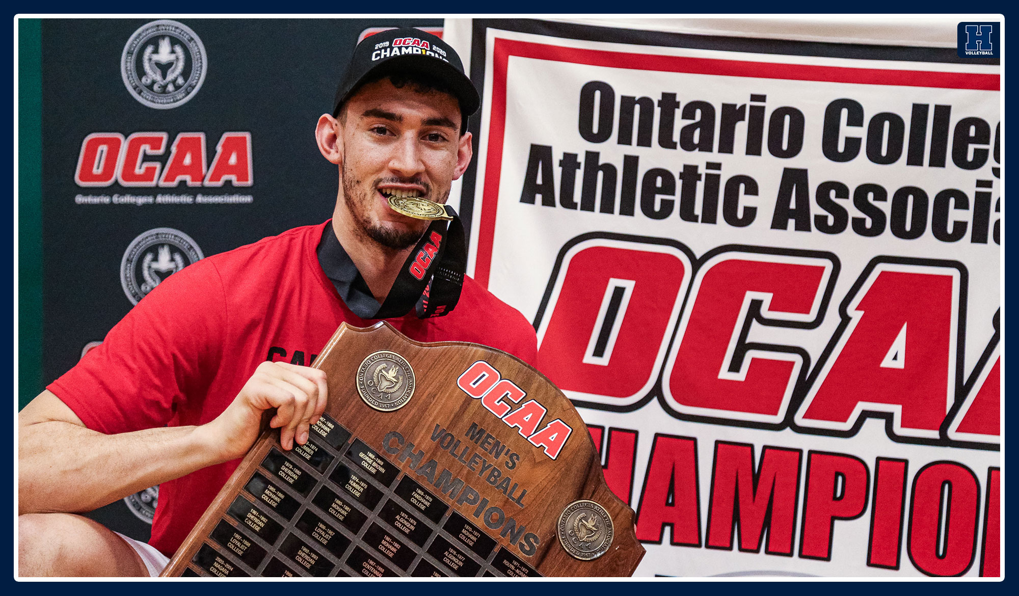 Andrew Blakey holding up the OCAA trophy