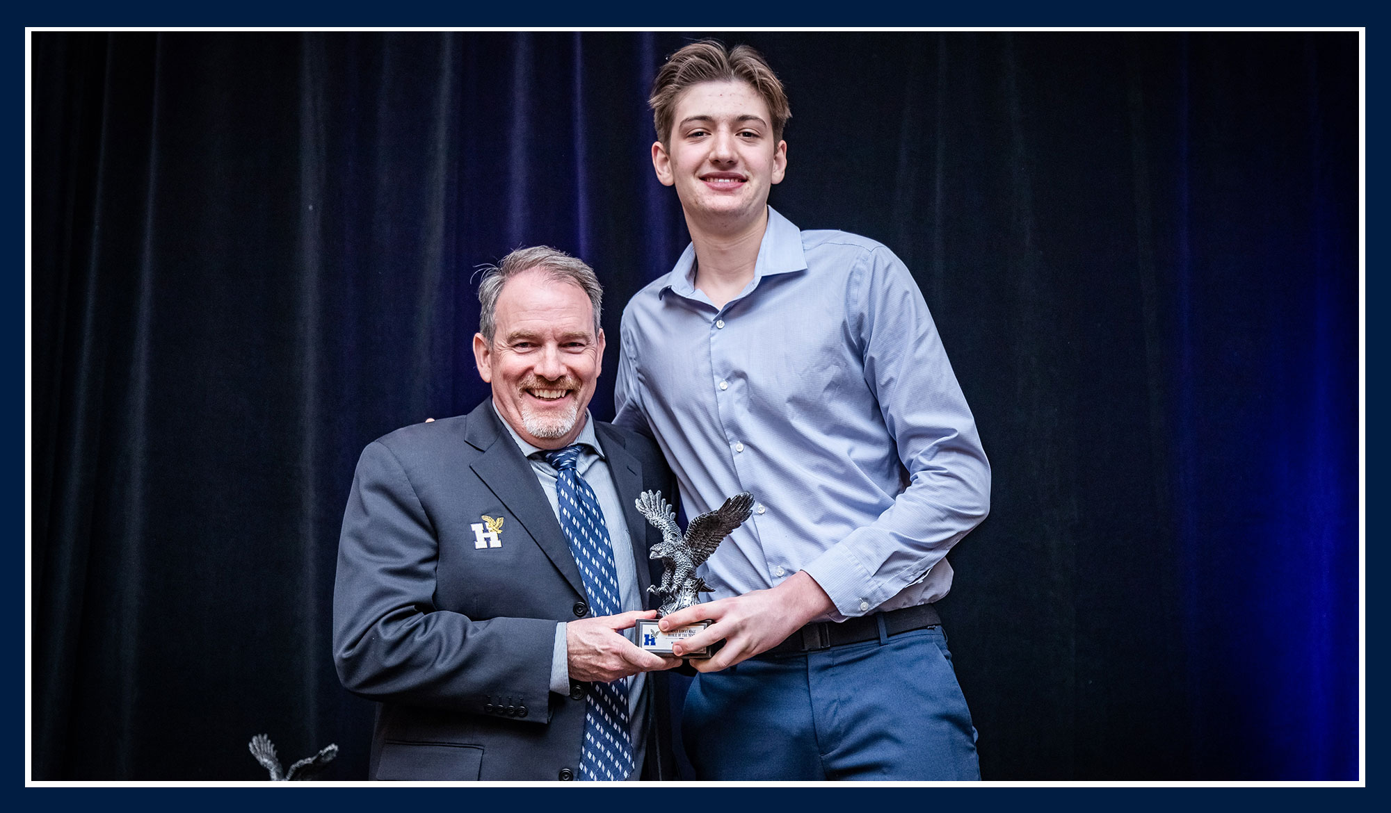 Micahel receiving his award from Ray Chateau