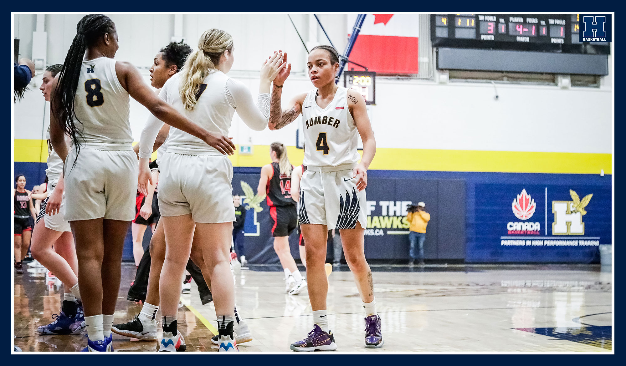 Nicole Chateau and Brittney English celebrating during a time out